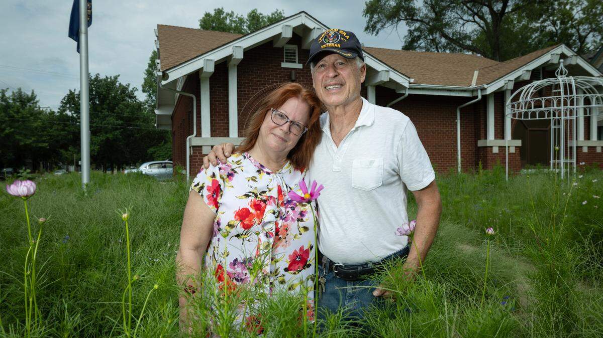 Carey and Tom Tarkman, who are opening the Rose & Peacock Social Club at the former Firehouse No. 7 in Riverside this fall, have to cut the tallgrass and wildflowers they planted due to neighbors’ complaints and city code.