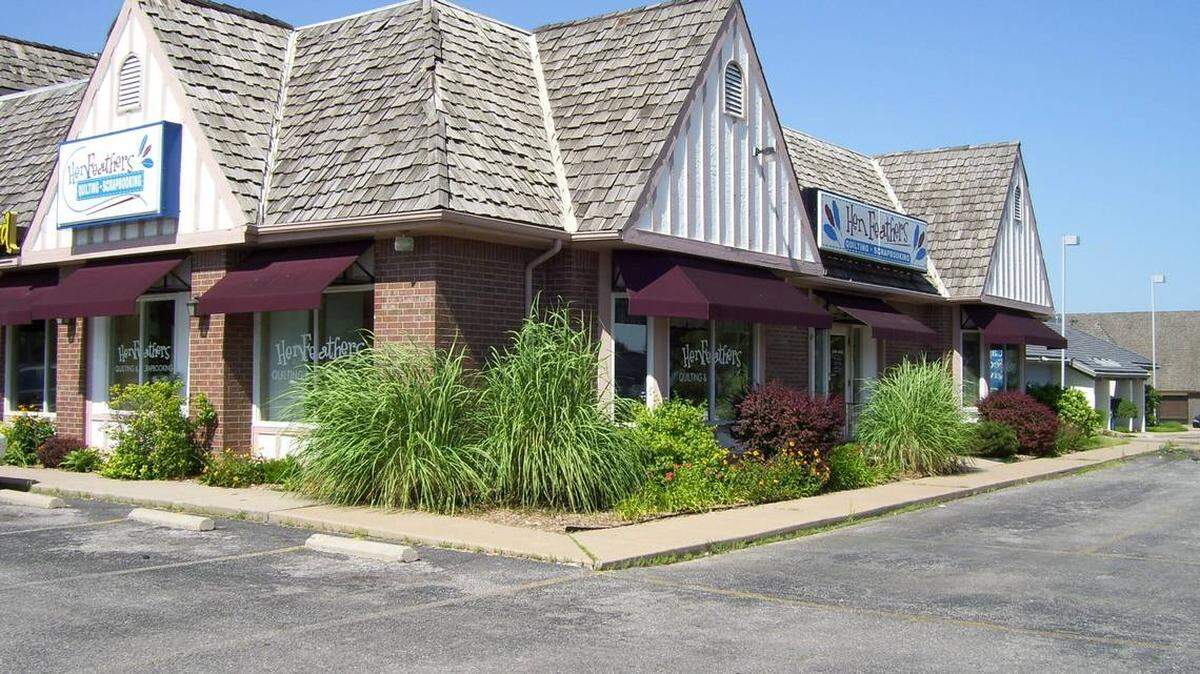 The longtime building where Hen Feathers and a few other businesses used to be at the northeast corner of Douglas and Rock Road was demolished this week to make room for a new 7 Brew Coffee.