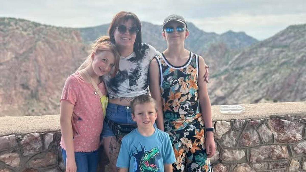 Lydia Barton and her two sons, 13-year-old Jesse Kinney and 7-year-old Ronan Barton, all died in a Jan. 4 head-on crash with a wrong-way driver on I-135 in Wichita. They are pictured here at the Royal Gorge in Colorado along with their sister. 