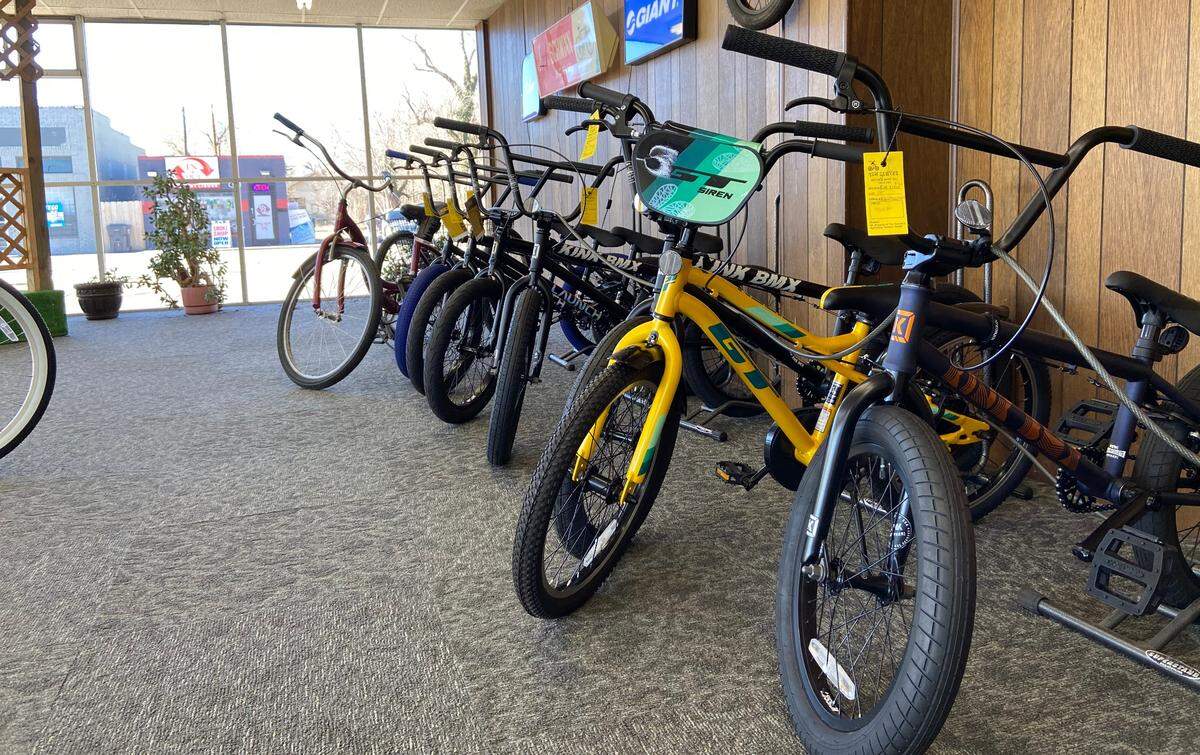 Kids bikes lined up against the wall of Tom Sawyer Bicycle Shop. The longtime business will close after 60 years of service.