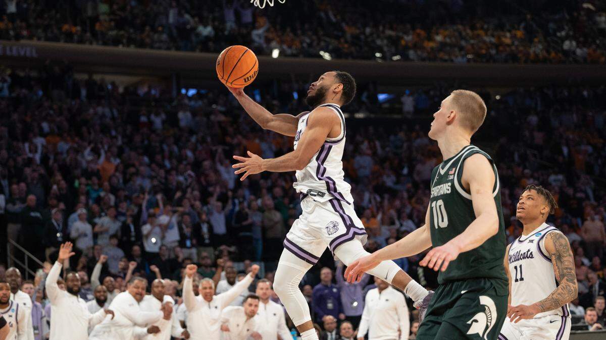 Kansas State’s Markquis Nowell puts up the final shot just before the the buzzer in overtime to advance past Michigan State to east region final on Saturday.