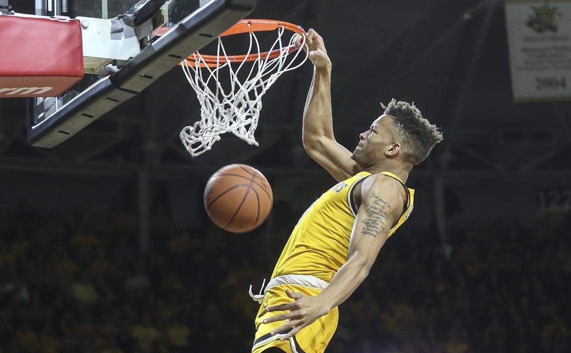 Wichita State guard Dexter Dennis throws down. Dunk during the first half of their game against East Carolina at Koch Arena on Tuesday.