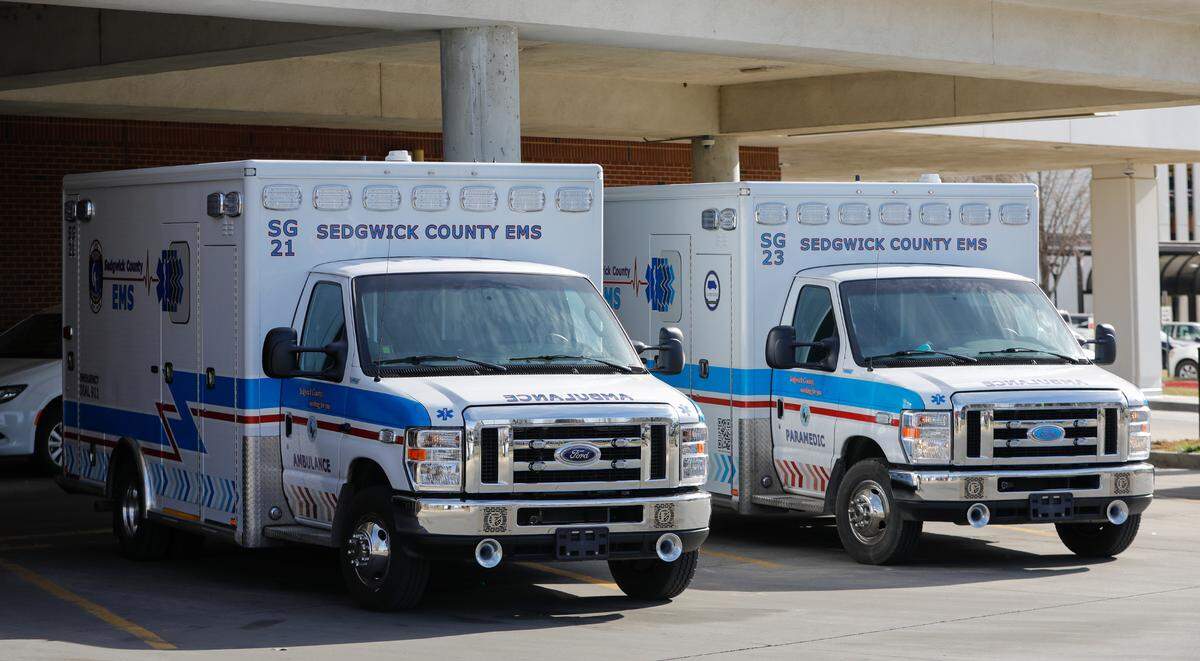 Two Sedgwick County EMS ambulances parked outside of St. Francis. The odds of EMS reaching a patient within the industry standard 9 minutes have dropped by more than 10 percentage points since 2019.