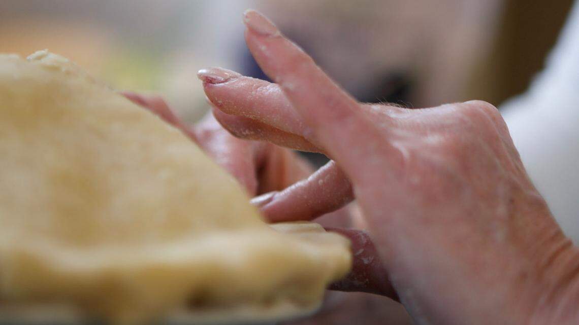 Pinch the crusts together on your Dulce De Leche Apple Pie.