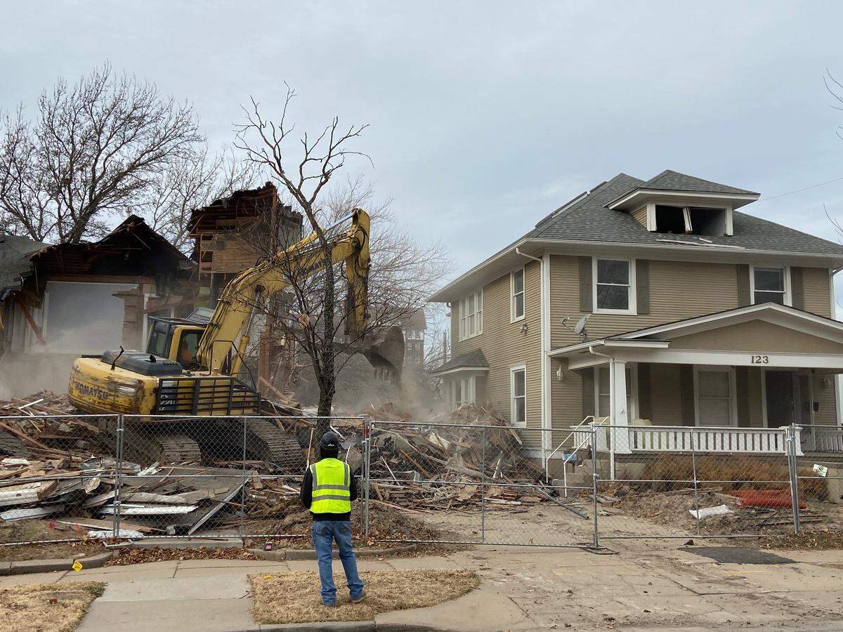Two houses behind Happiness Plaza on South Clifton in College Hill were purchased by the development’s owners then torn down in 2021.