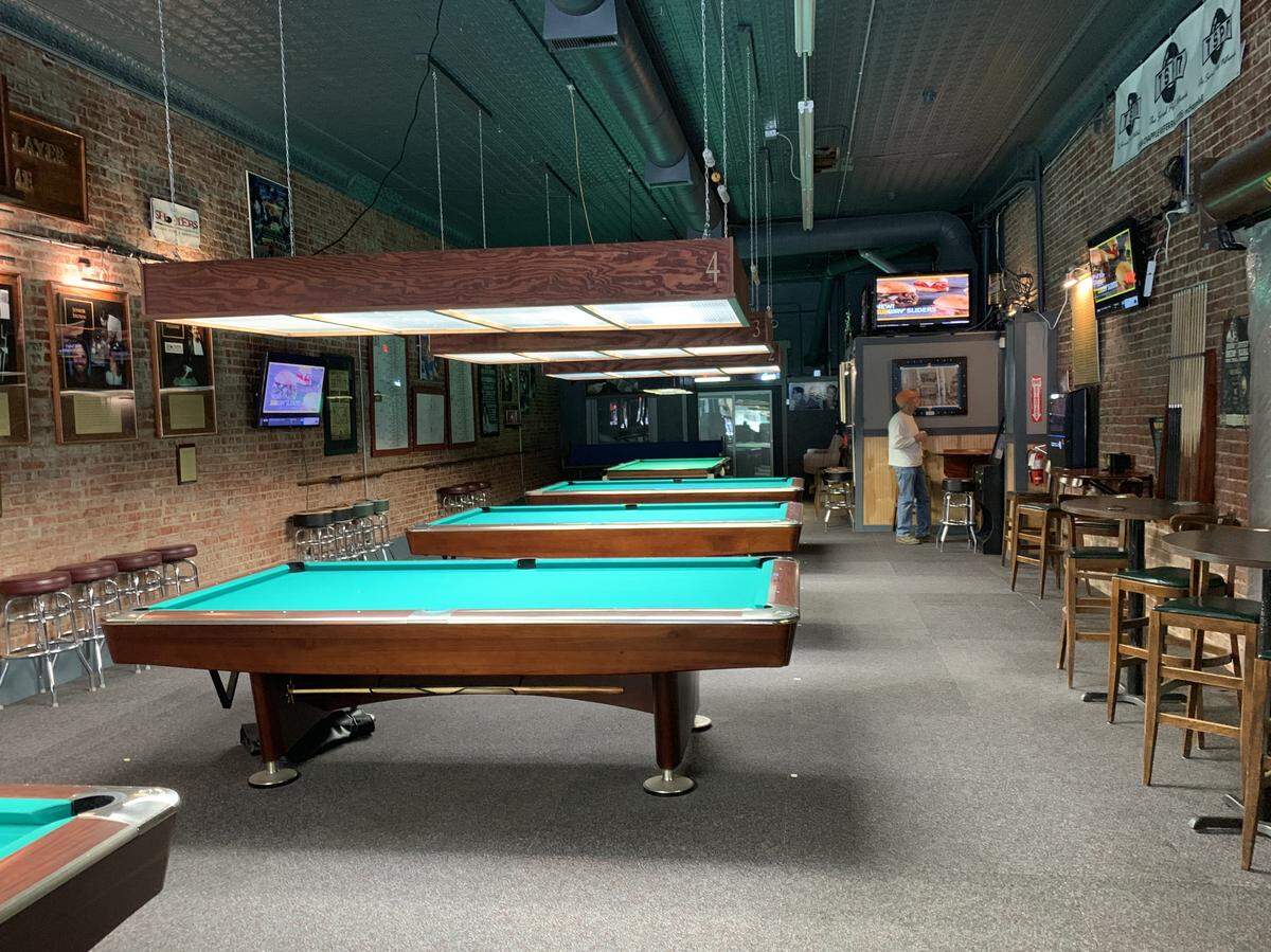 It’s operating in half the size, but Club Billiards still has several nine-foot and a couple of seven-foot tables.