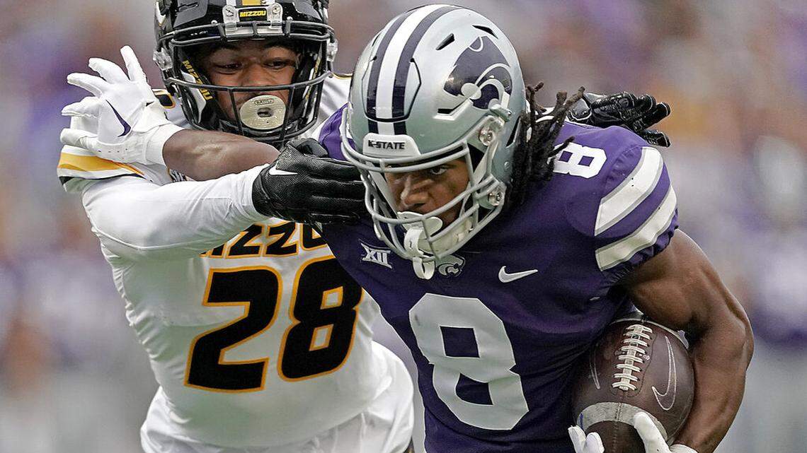 Kansas State wide receiver Phillip Brooks (8) is tackled by Missouri defensive back Joseph Charleston (28) during the first half of an NCAA college football game Saturday, Sept. 10, 2022, in Manhattan, Kan. (AP Photo/Charlie Riedel)