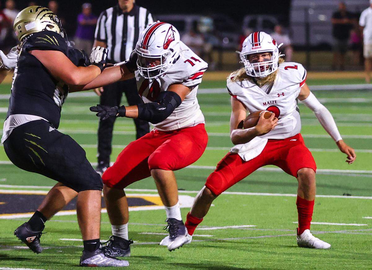 Zach Wertz (No. 74) is one of four seniors who help pave the way for Avery Johnson (No. 2) and the rest of Maize’s dynamic skill position players.