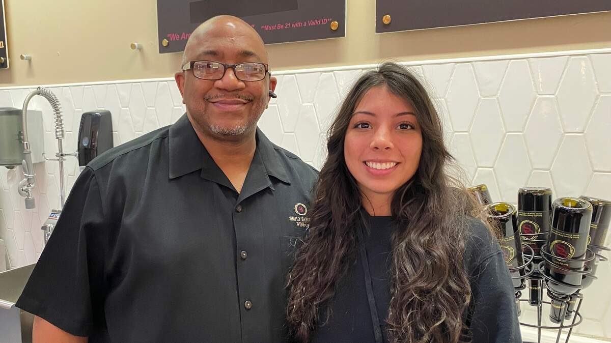 Simply Sangria owner Brian Miller, pictured here with his Towne East Square manager Presley Moreno, will soon start serving pizza at the mall and add lunch service to his retail spot near Second and Cleveland.