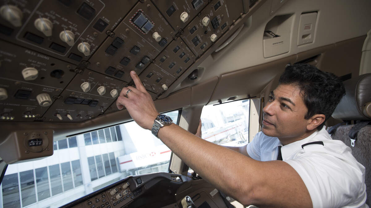 An American Airlines pilot works in the cockpit of one of the carrier's aircraft.