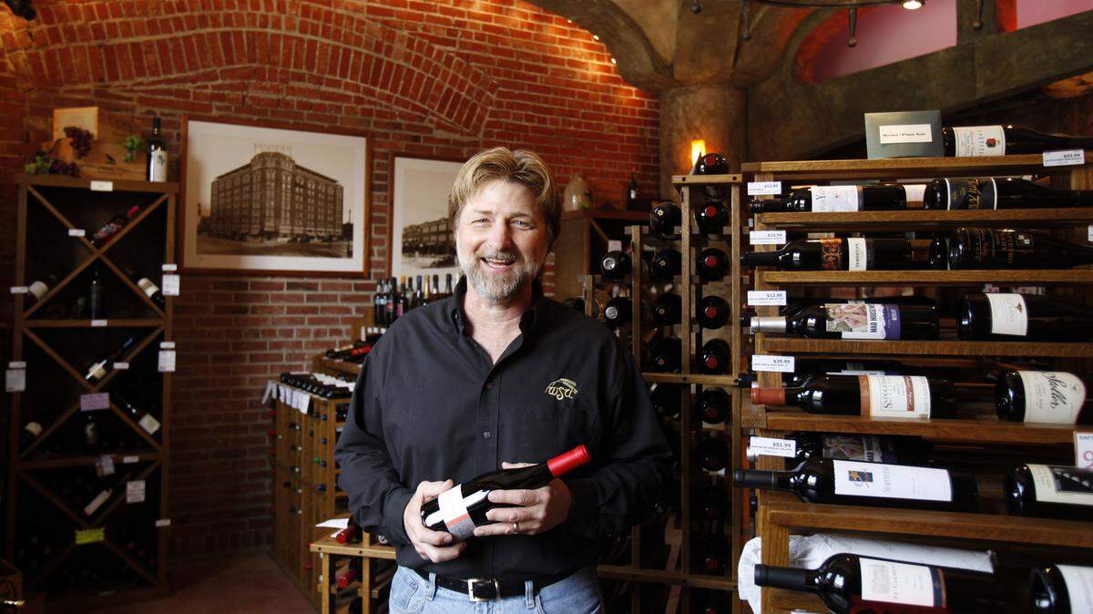 Don Siedhoff is pictured in 2010 at his Beyond Napa wine shop in Old Town Square.