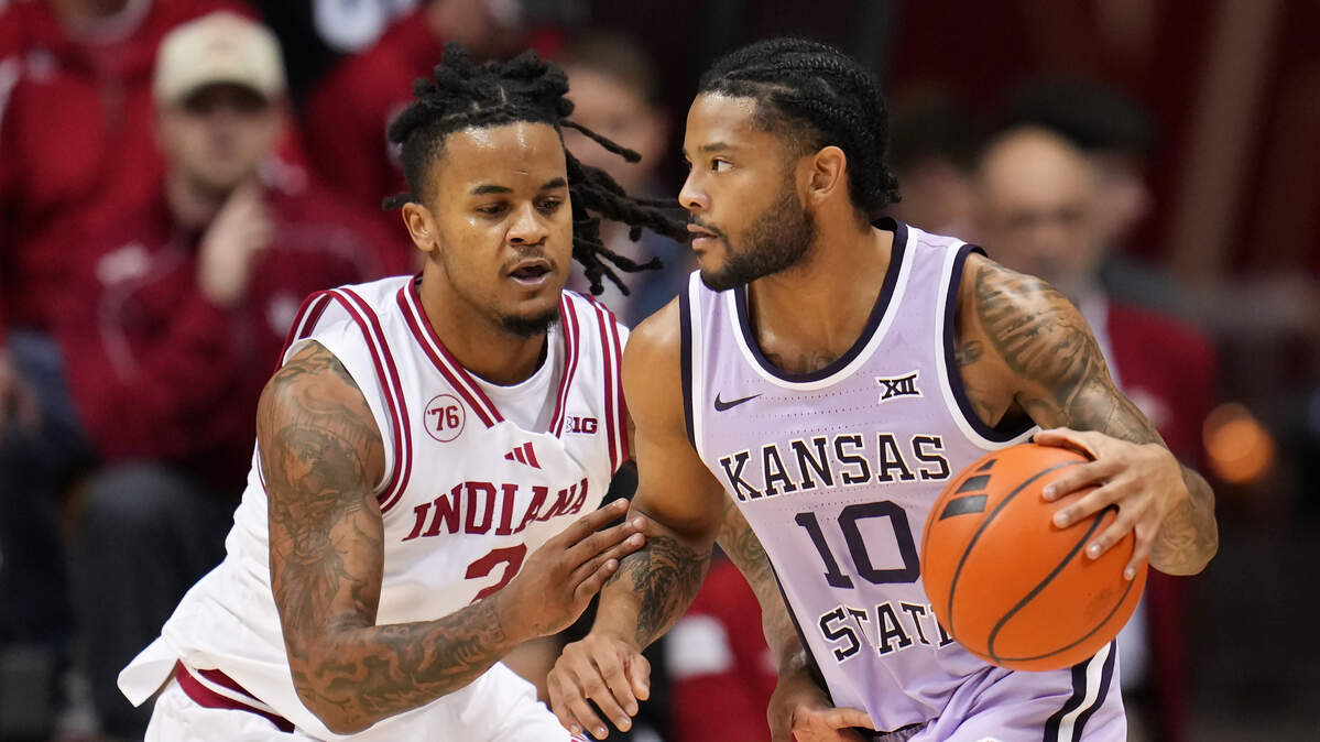 David Castillo #10 of the Kansas State Wildcats dribbles the ball while being guarded by Lamar Wilkerson #3 of the Indiana Hoosiers in the first half at Simon Skjodt Assembly Hall on November 25, 2025 in Bloomington, Indiana.