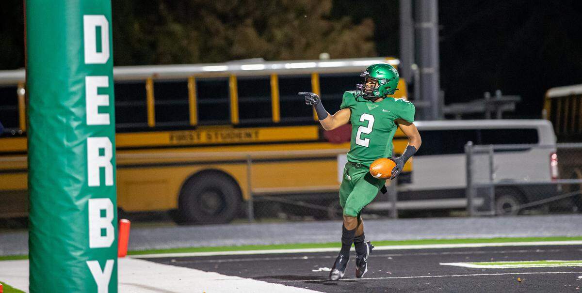 Derby running back Dylan Edwards celebrates after scoring a touchdown in the Panthers’ 27-21 win over Lawrence Free State on Friday.