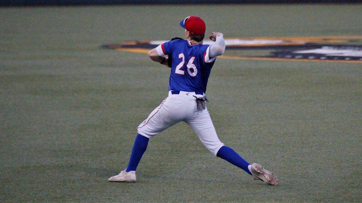 Australian Jarrod Belbin rifles home from right field, playing for the Hays Larks in the 2019 NBC World Series.