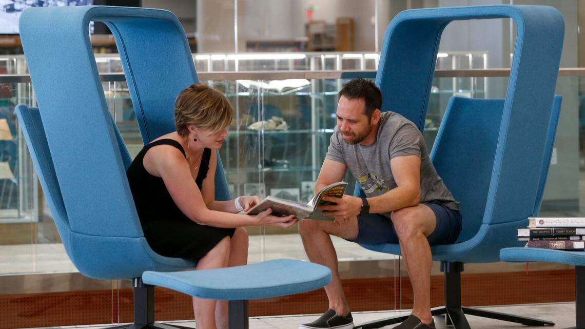 Rachel and Jonathan Farney share some information at the Advanced Learning Library Wednesday. (July 18, 2018)