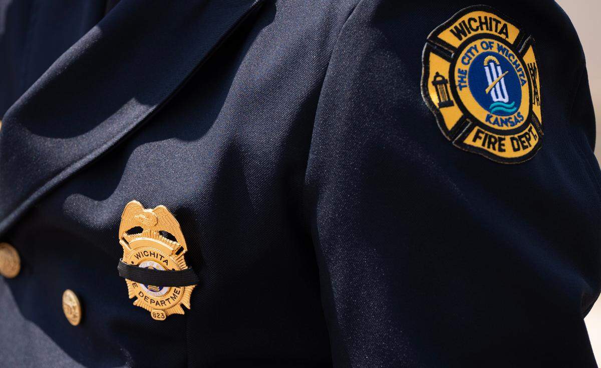Firefighters wore a black band in honor of Wichita firefighter Ty Voth.