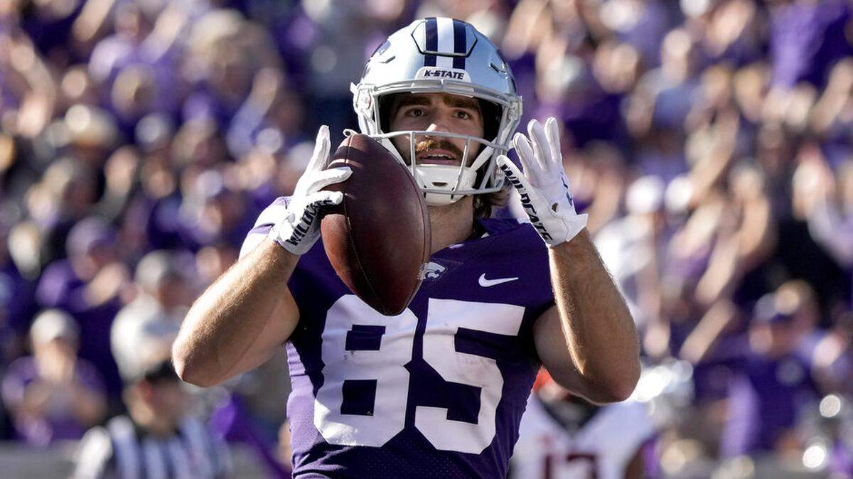 Kansas State wide receiver Kade Warner celebrates in the end zone after scoring a touchdown during the first half of an NCAA college football game against Oklahoma State Saturday, Oct. 29, 2022, in Manhattan, Kan. (AP Photo/Charlie Riedel)