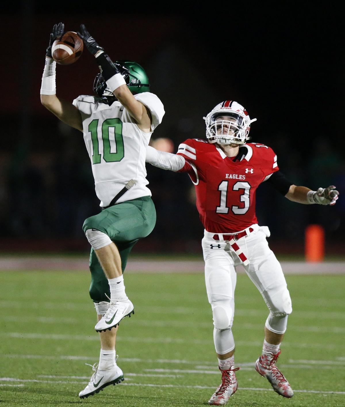 Derby defender #10 Dax Benway intercepts a pass intended for #13 Jordon Helm. (October 19, 2018)