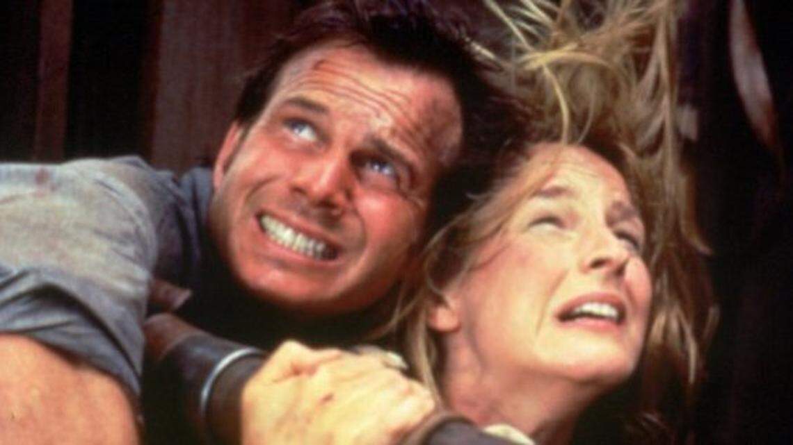 The special effects are a knockout in the movie ``Twister,'' as Helen Hunt and Bill Paxton, cling to each other.  (AP Photo)