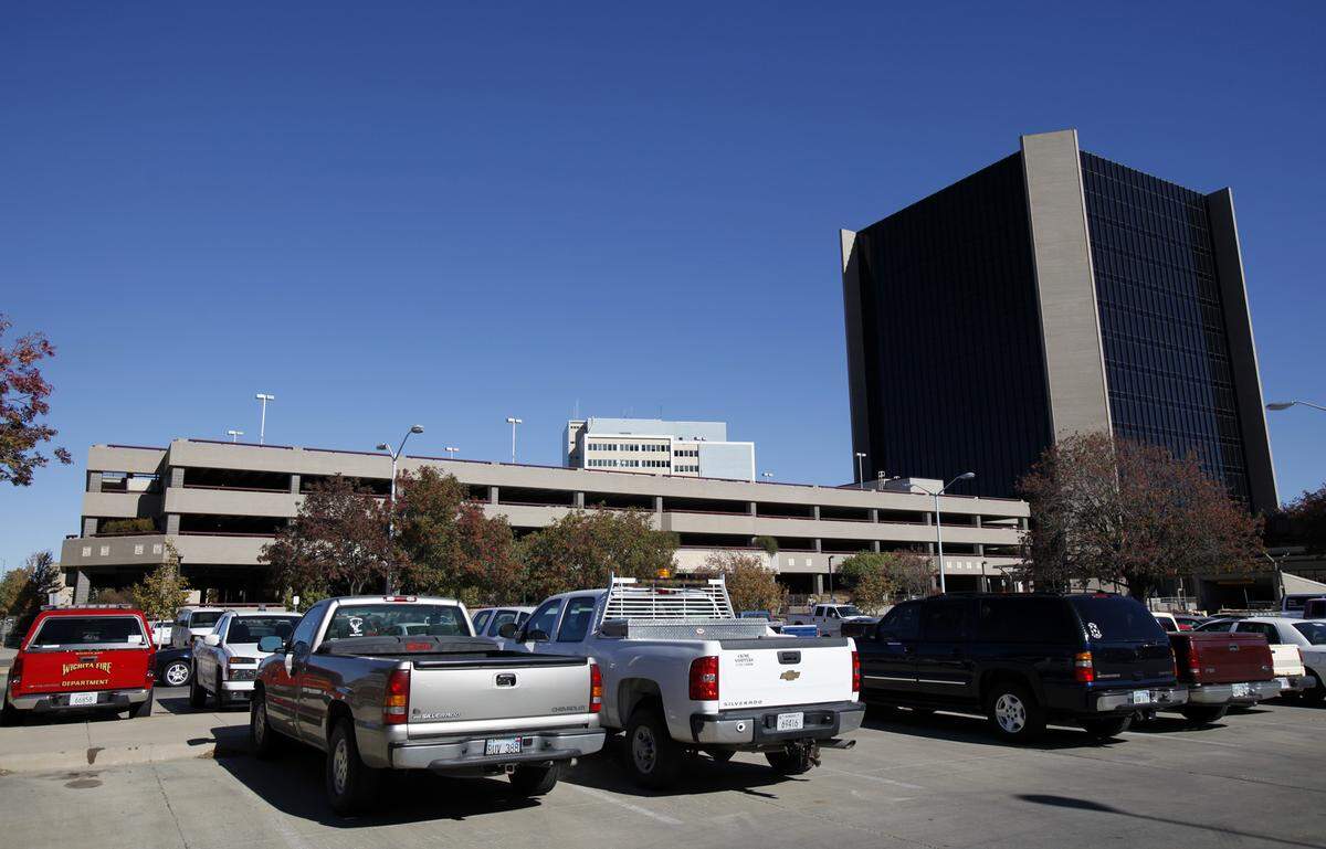The city of Wichita has banned public parking from the City Hall garage since shortly after the 9/11 attacks, but city vehicles routinely clog the remaining public surface lot.