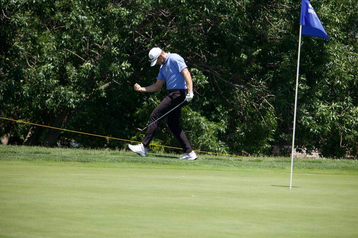 Myles Creighton celebrates after chipping on his final hole of Saturday’s round to shoot an 11-under-par 59, which tied the Wichita Open tournament record.