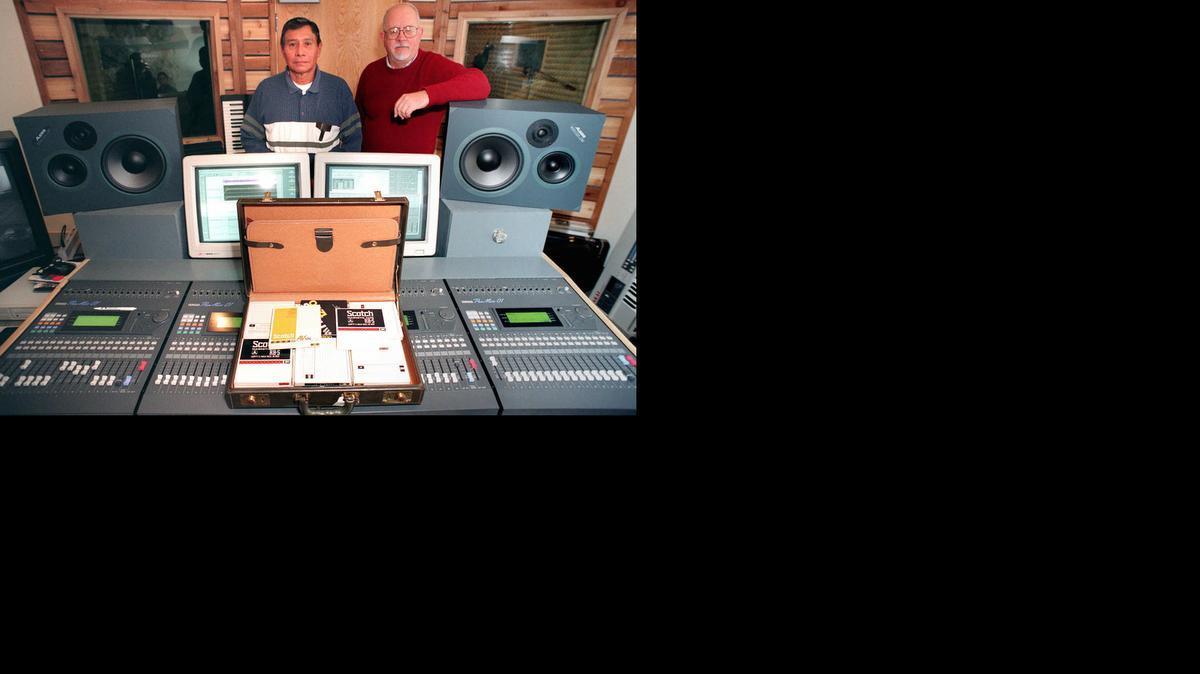 In the fall of 1996, Johnnie Ray McCauley, left, one of the last members of the Kaw Nation to speak the language, and Robert Rankin, a University of Kansas linguistics professor, stand with 28 reel-to-reel tapes of the Kaw language. The tapes were converted to compact discs, allowing new generations of the tribe to learn the Kaw language.

