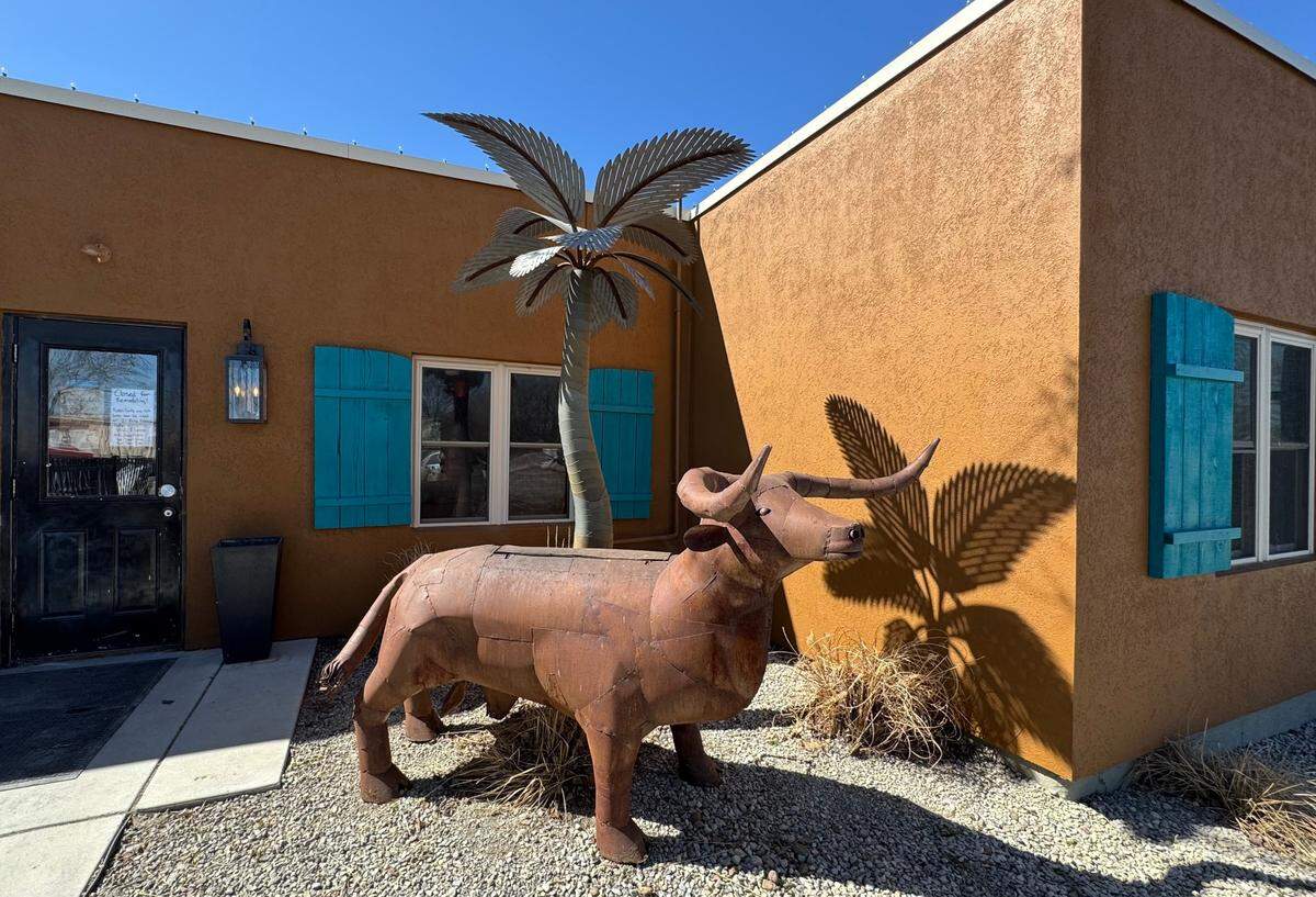 A steer-shaped meat smoker that exhales smoke from its nostrils greets customers at the entrance of the soon-to-open Abode Bistro & Bar in Andover.
