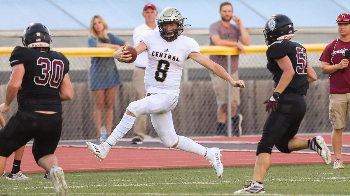Andover Central senior quarterback Braden Barscewski runs against Buhler in last Friday’s game.