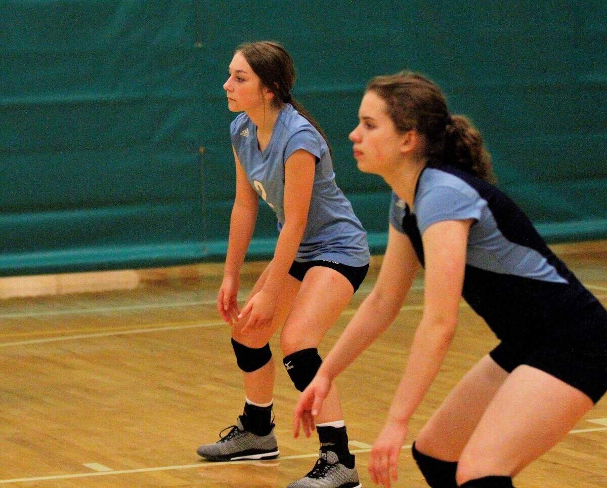 East sophomore libero Brooke Tholen gets ready for a serve during the Blue Aces triangular with Bishop Carroll and Kapaun Mt. Carmel on Tuesday. (Sept. 4, 2018)
