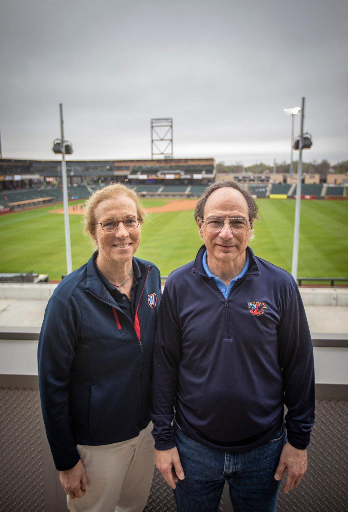 Wichita Wind Surge partners Jane Schwechheimer and Jordan Kobritz are pictured before a recent day game at Riverfront Stadium. Kobritz, CEO, and Schwechheimer are leading the ball club since the 2020 COVID-19 death of Lou Schwechheimer, Jane Schwechheimer’s husband and the team’s founder.