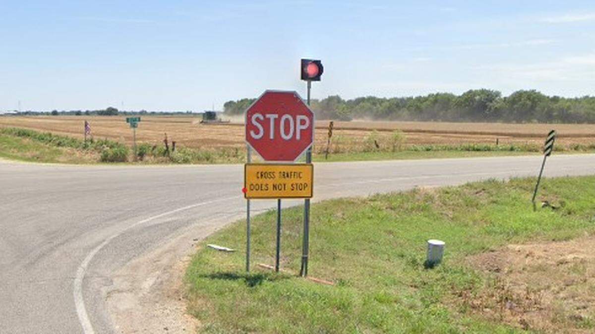 An enhanced stop sign with a “cross traffic does not stop” placard and a flashing light beacon. These stop signs sit on both sides of 167th Street at the intersection with 21st Street in west Sedgwick County.