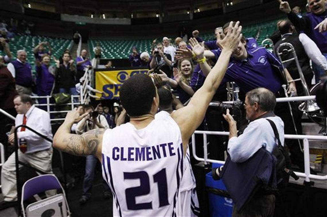Kansas State’s Denis Clemente celebrates his team’s 101-96 double-overtime win over Xavier with fans following an NCAA West Regional semifinal college basketball game in Salt Lake City, Thursday, March 25, 2010. (AP Photo/Paul Sakuma)