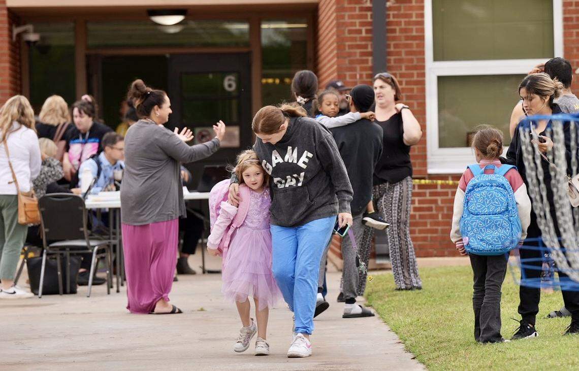 Parents pick up their kids from Cessna Elementary School on Monday, Sept. 23, 2024 after a nearby shooting put the school on lockdown.