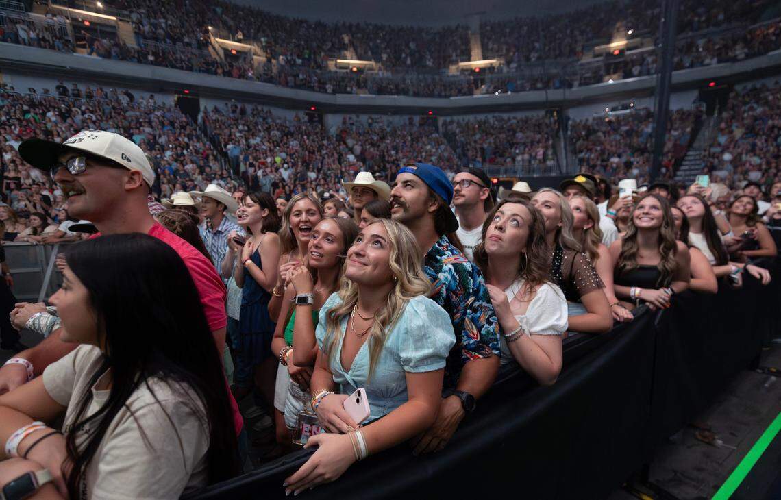 Zach Bryan fans listen as he plays to a packed Intrust Bank Arena on Sunday night.