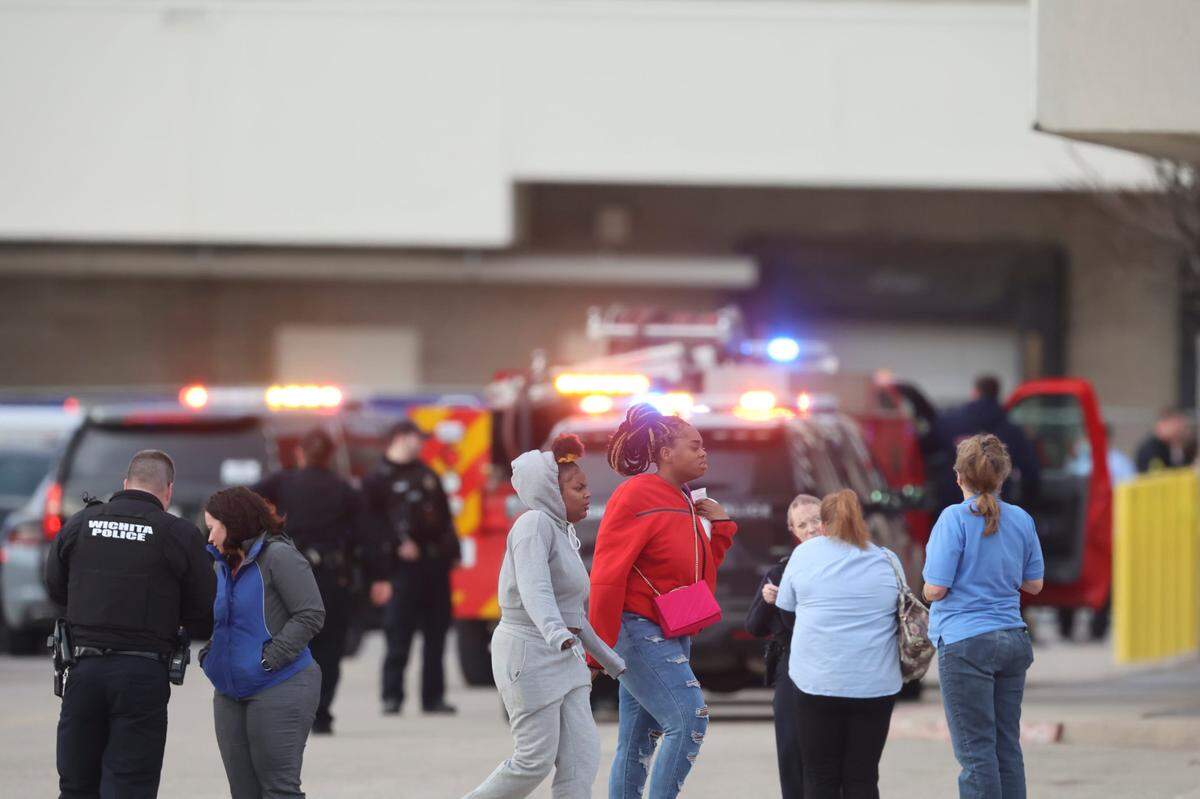 A group of people leave Towne East Mall where Wichita police are investigating a shooting, Wichita police spokesperson said Friday night.