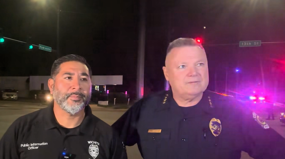 Wichita police public information officer Rick Pena and Police Chief Joe Sullivan answer media questions at the scene of the shooting Thursday near 13th and Hydraulic.