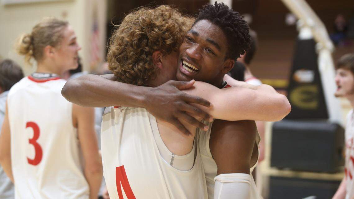 Maize senior Jacob Hanna hugs a teammate after the Eagles won the Class 5A championship over Topeka West on Saturday, the first state title in program history.