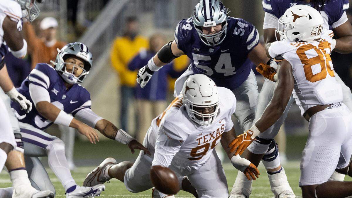 Texas defensive lineman Keondre Coburn scrambles after an Adrian Martinez fumble. Texas recovered the ball and went on to win Saturday in Manhattan, Kansas.