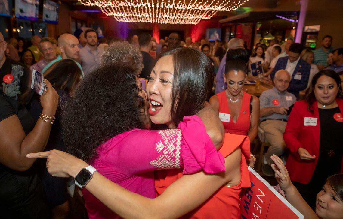 Lily Wu is hugged by supporters during the primary election for Wichita mayor in August. She faces current Mayor Brandon Whipple in the general election on November 7.