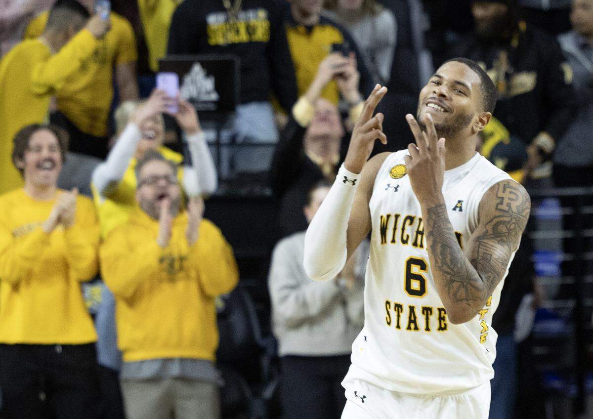 Corey Washington celebrates after Wichita State defeated Memphis 84-79 in overtime on Sunday at Koch Arena. 