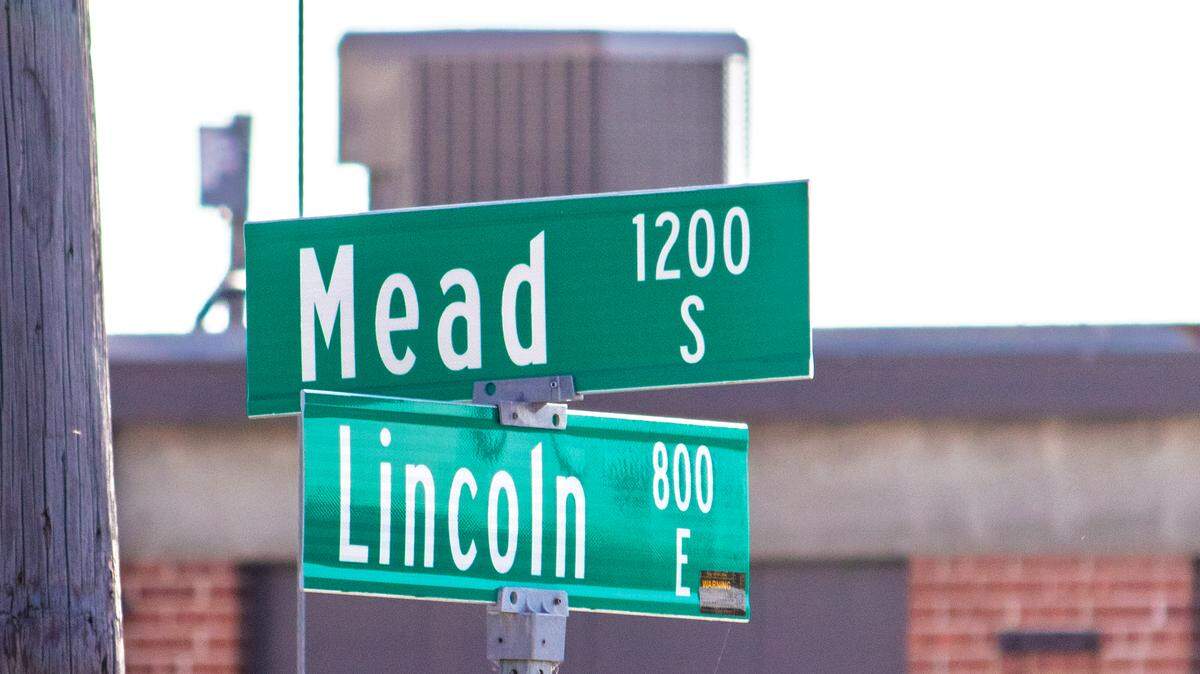 Wichita Police arrested a 43-year-old man Thursday afternoon after he allegedly pointed a gun at passing cars and school buses near Lincoln and Mead and Lincoln and Hydraulic.