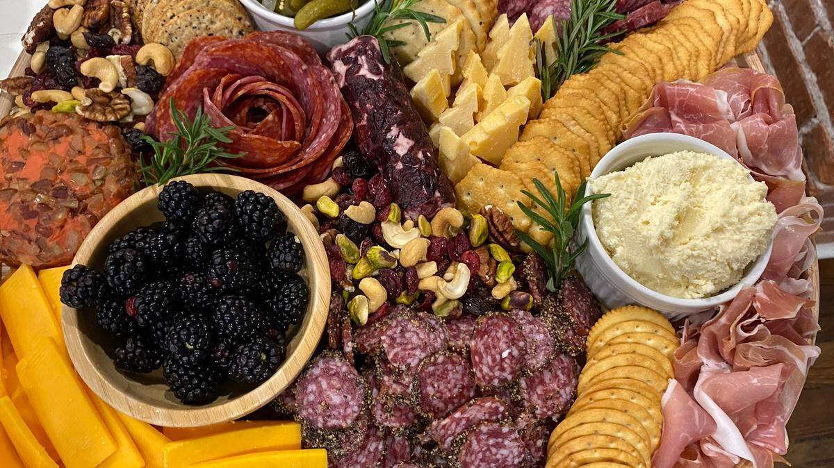Keep meats, cheeses, fruits and nuts on hand to throw together a holiday charcuterie board.