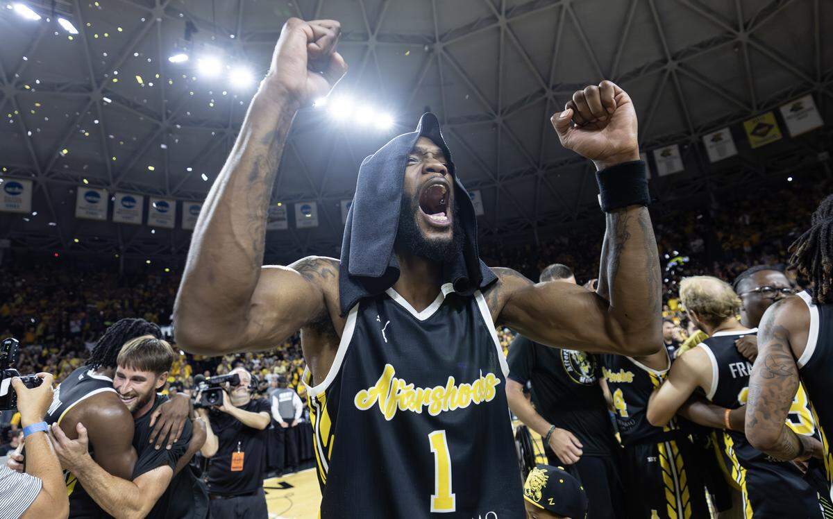 Markis McDuffie celebrates after the Aftershocks beat Eberlein Drive to win the million dollar TBT championship on Sunday at Koch Arena.