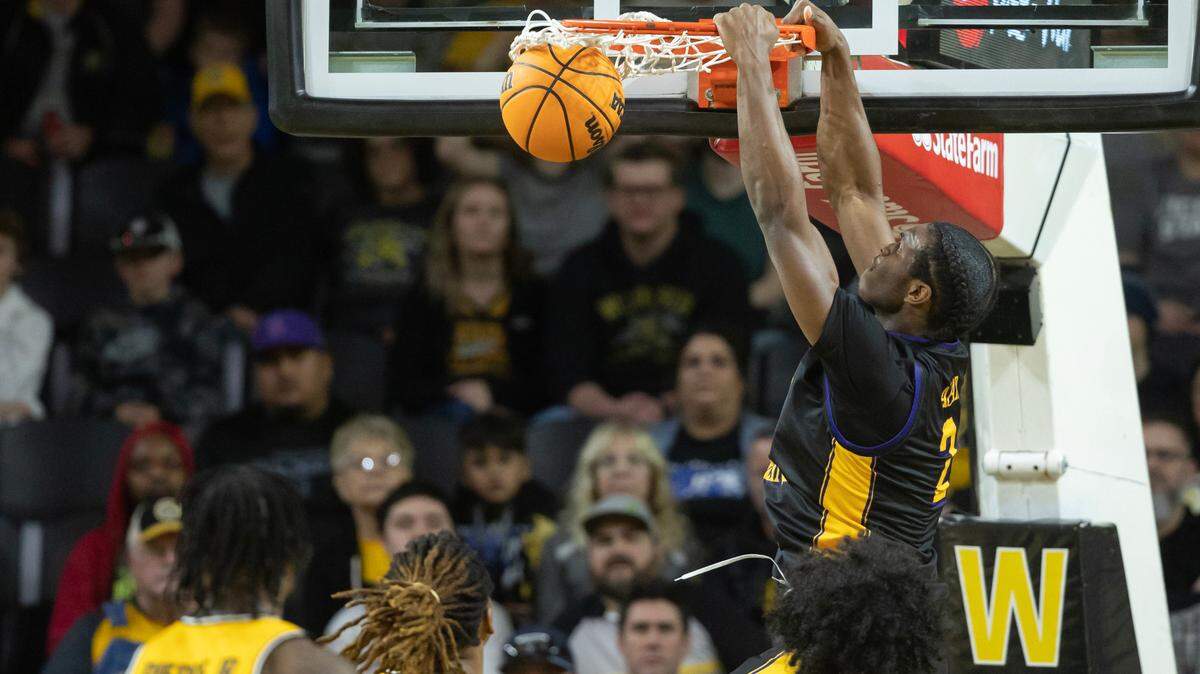 East Carolina’s Ezra Ausar dunks the ball during the first half of their 79-69 win over the Shockers on Saturday.