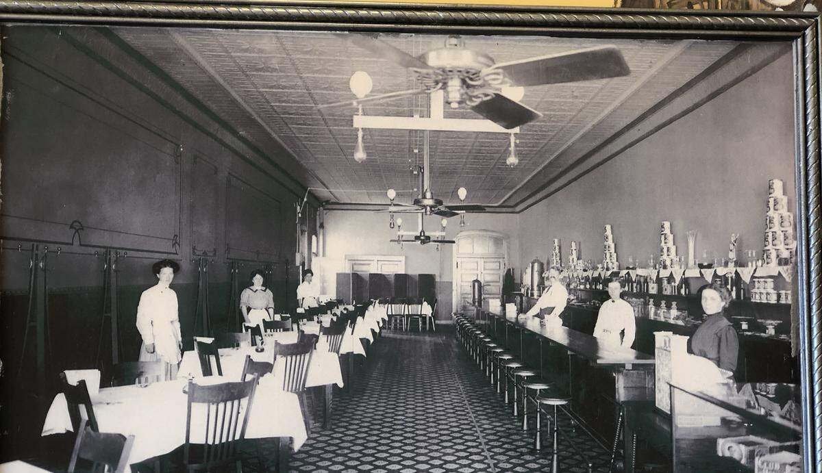 A muralist is recreating this photo from 1910, when Livingston’s first opened in Wichita.
