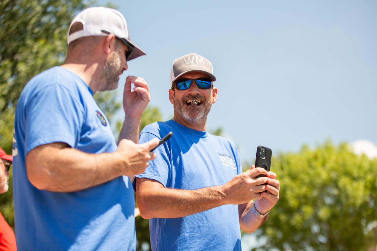 Audience members watch the cowboy bathtub races on June 1. The races took place on the Arkansas River on the second day of the Wichita Riverfest.