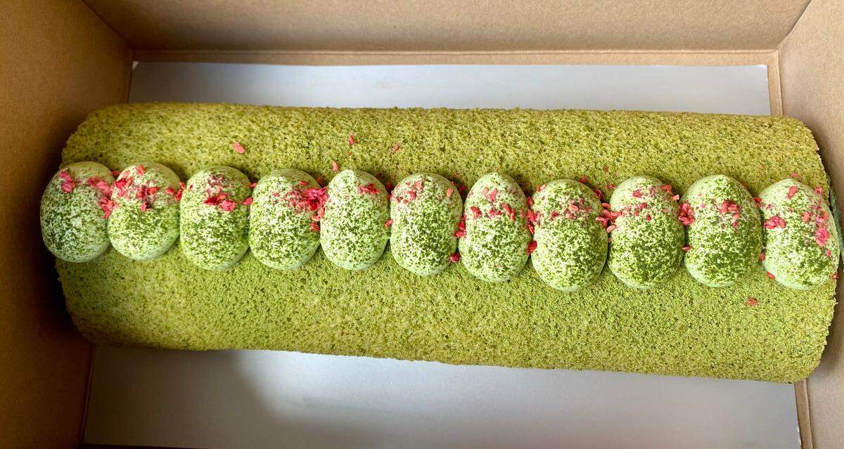 A green tea roll cake made by Komuji Japanese Bakery