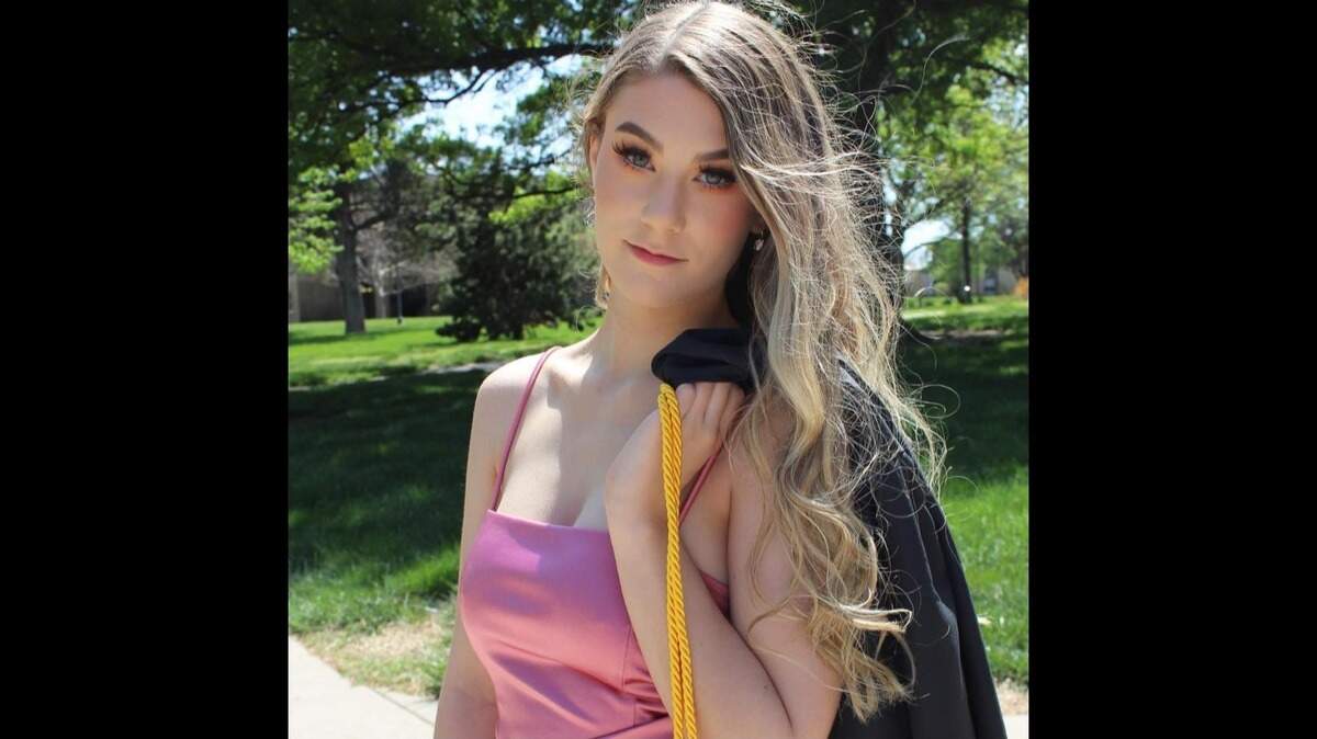 Brittnee Wicker poses for a photo as she graduated from Newman University in 2022. The 24-year-old was found fatally shot in her south Wichita apartment on Nov. 12.
