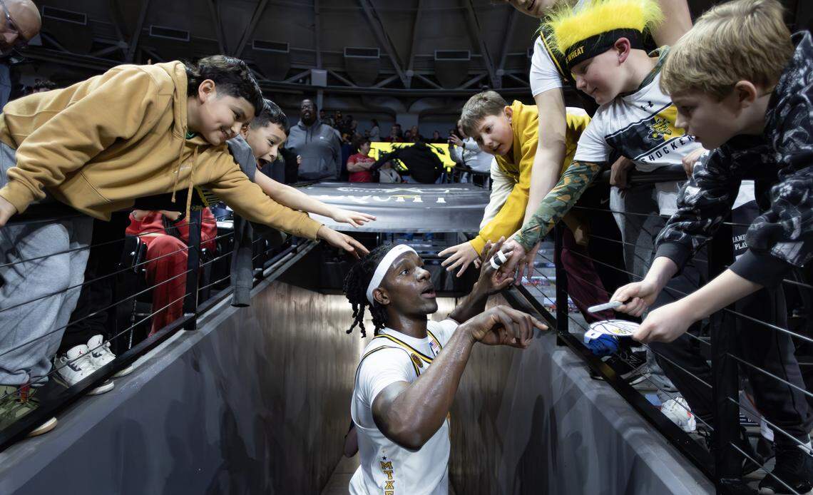 Wichita State’s Karon Boyd is congratulated by fans as he leaves the court after help lead his team in a second half comeback against Tulsa at Koch Arena on Saturday night.