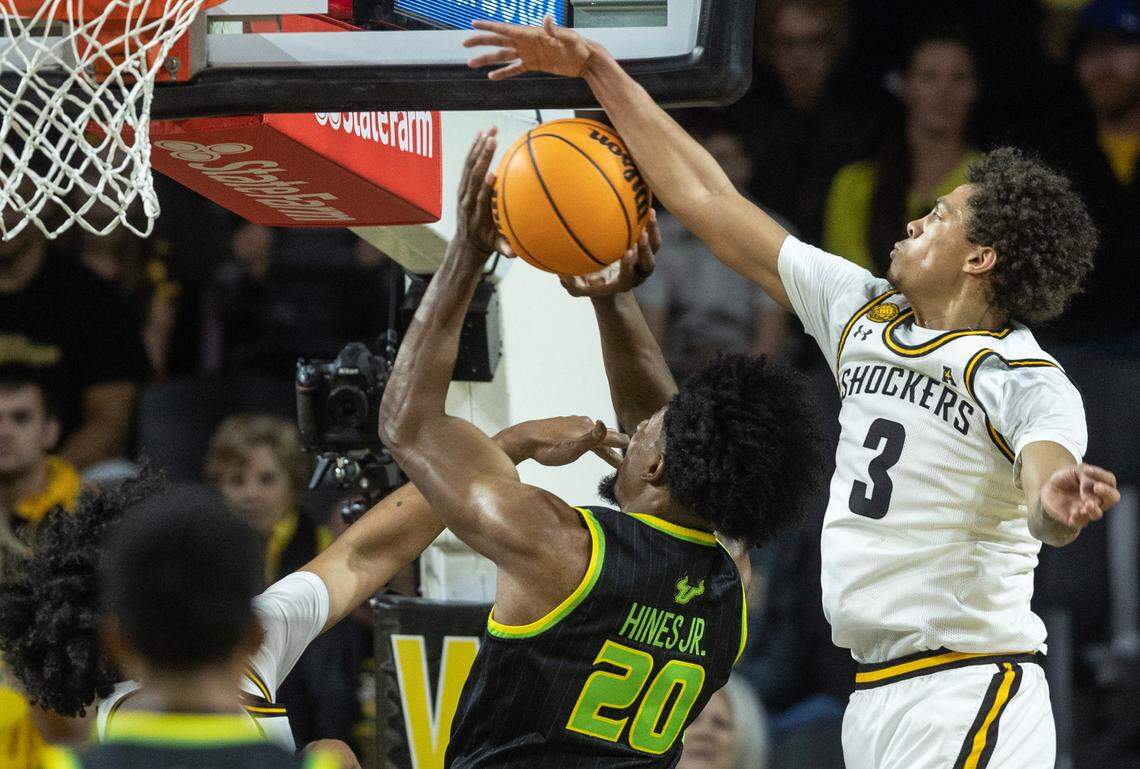 Wichita State’s Craig Porter Jr., blocks the shot of South Florida’s Sam Hines Jr. on Sunday.